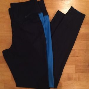 Nike athletic running leggings with blue stripes